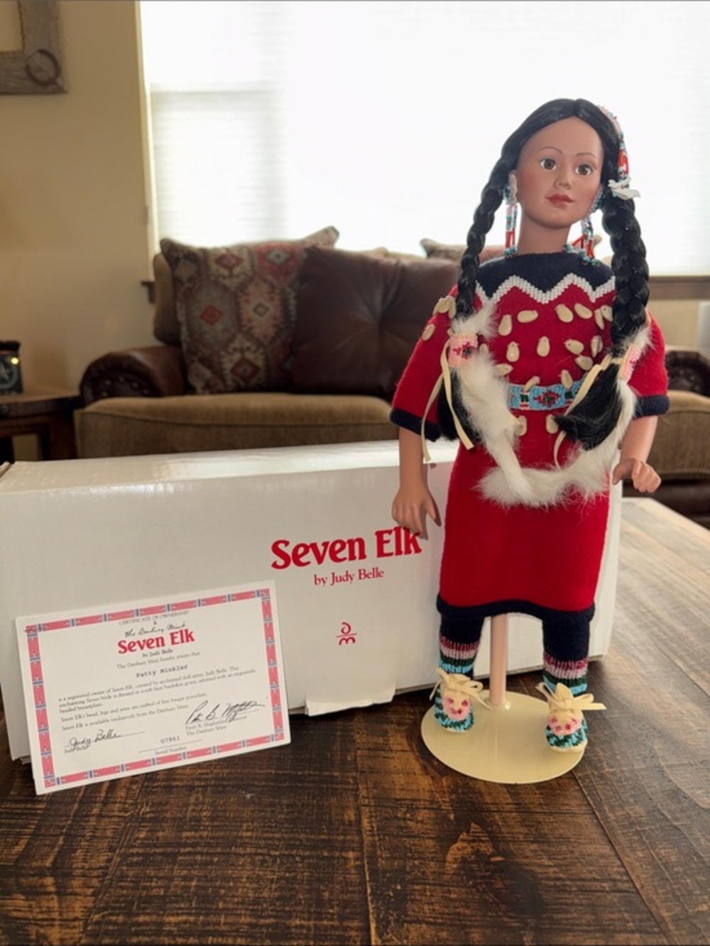 Danbury Mint Seven Elk Doll in Red Dress with Black Braids
